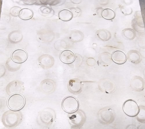 Judy Larson's Wire Links 7, 8, 9, and 10 - , Findings & Components, Toggles & Clasps, Earwire & Headpin, Butane Torch, Soldering, Solder, Space the closed rings out on a Solderite board.